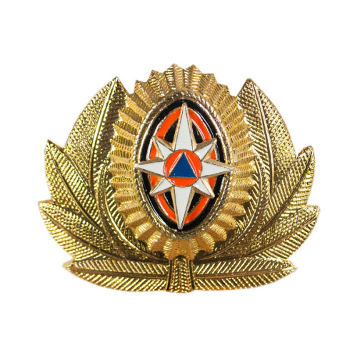 Кокарда МЧС в обрамлении золота